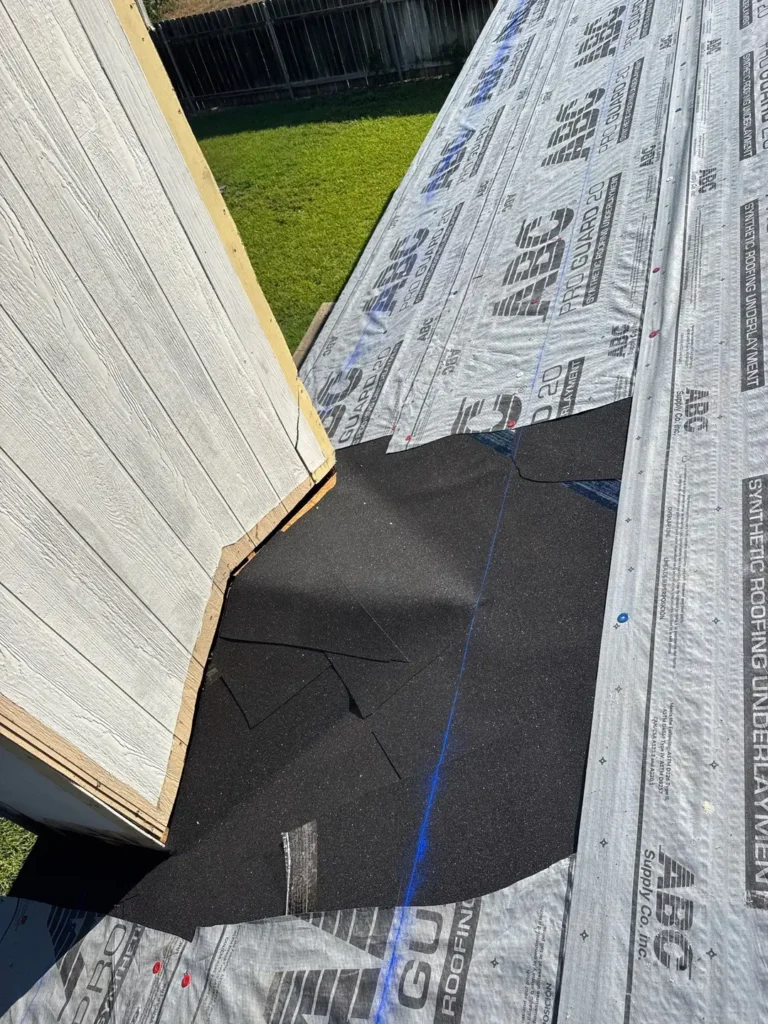Leak barrier at the roof-to-wall junction and ABC Pro Guard 20 synthetic underlayment on a Cedar Park, TX roof