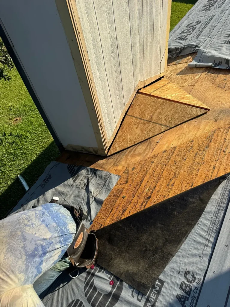 New OSB roof decking installed where the roof meets a sidewall during a roof replacement in Cedar Park, TX