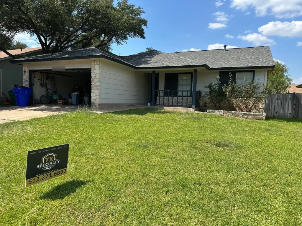 Completed roof replacement on a Cedar Park, TX 78613 home with a TX Specialty Roofing yard sign