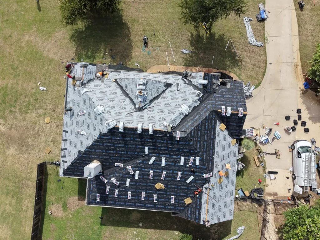 Drone view of synthetic underlayment and valley leak barrier installed during a roof replacement in Liberty Hill, TX