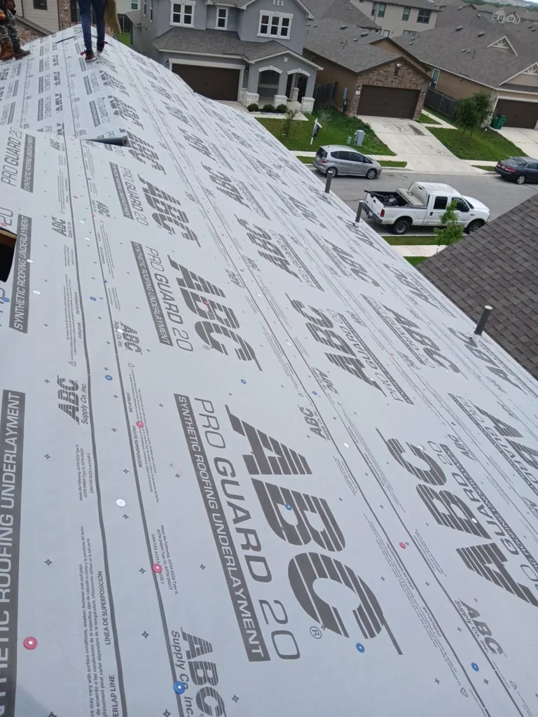 ABC Pro Guard 20 synthetic roofing underlayment installed across the roof deck during a roof replacement in Uhland, TX
