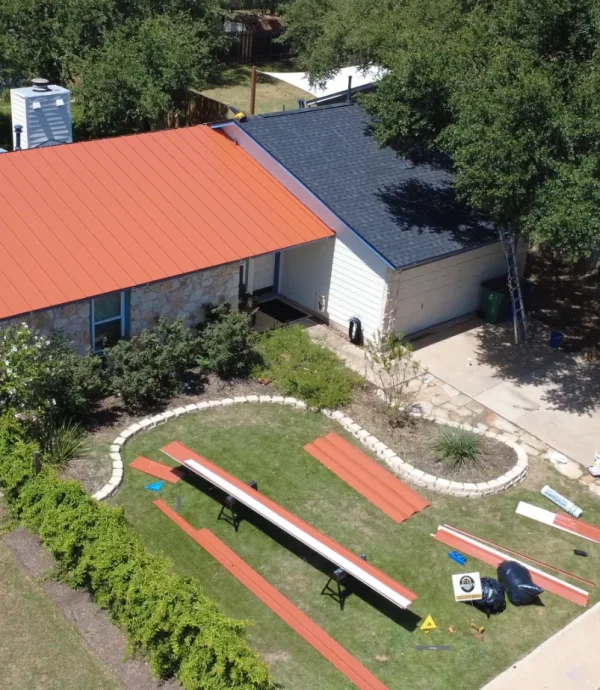red-metal-roof-installation-aerial